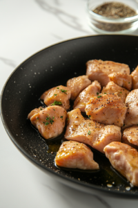 This image shows chicken cooking in the skillet, stirred occasionally