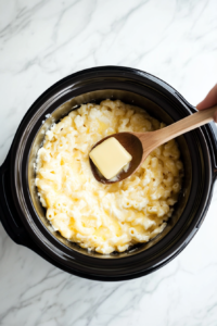 mixing-butter-in-the-warm-macaroni to mix the buttery flavour easily in the warm macaroni