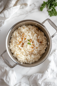 This image shows a covered pot of cooked wild rice resting, an essential step to ensure the grains are tender and fluffy.