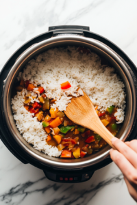 cooked-rice-being-mixed-into-the-pan