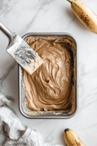 folding-in-bananas-sour-cream-and-walnuts