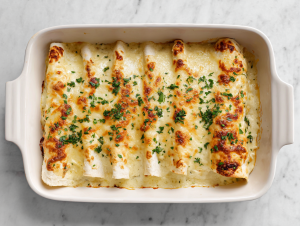 white-chicken-enchiladas-featured-top-down-baked-cheesy